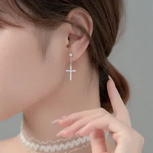 Boucles d'oreilles en forme de croix avec motif étoile