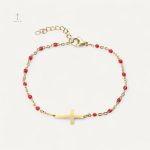 Bracelet croix chic en perles et dorure