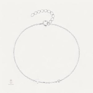 Bracelet croix délicat avec une pierre précieuse scintillante