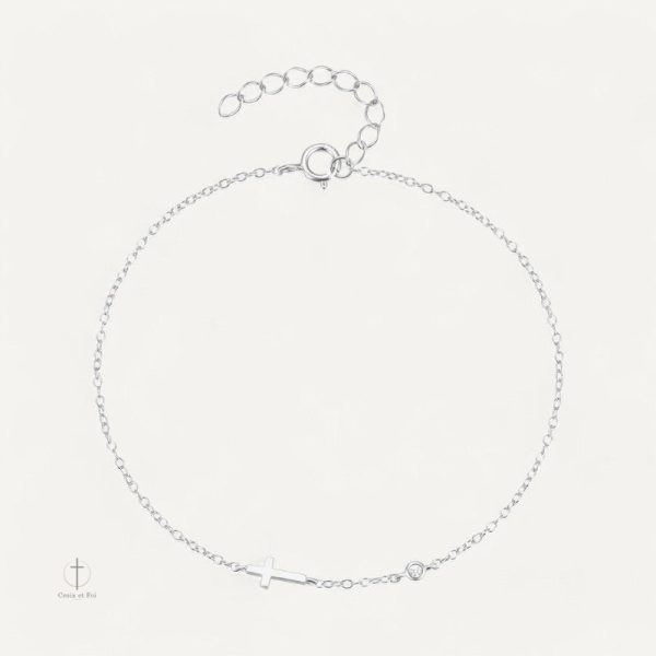 Bracelet croix délicat avec une pierre précieuse scintillante
