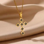 Bijou croix dorée sur chaîne en ébène