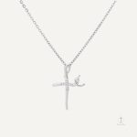 Accessoire Croix avec motif ondulé, style unique et raffiné